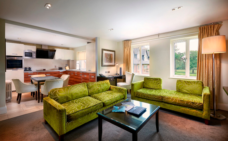 Living room and kitchen view of Armstrong apartment at Rockliffe Hall Hotel